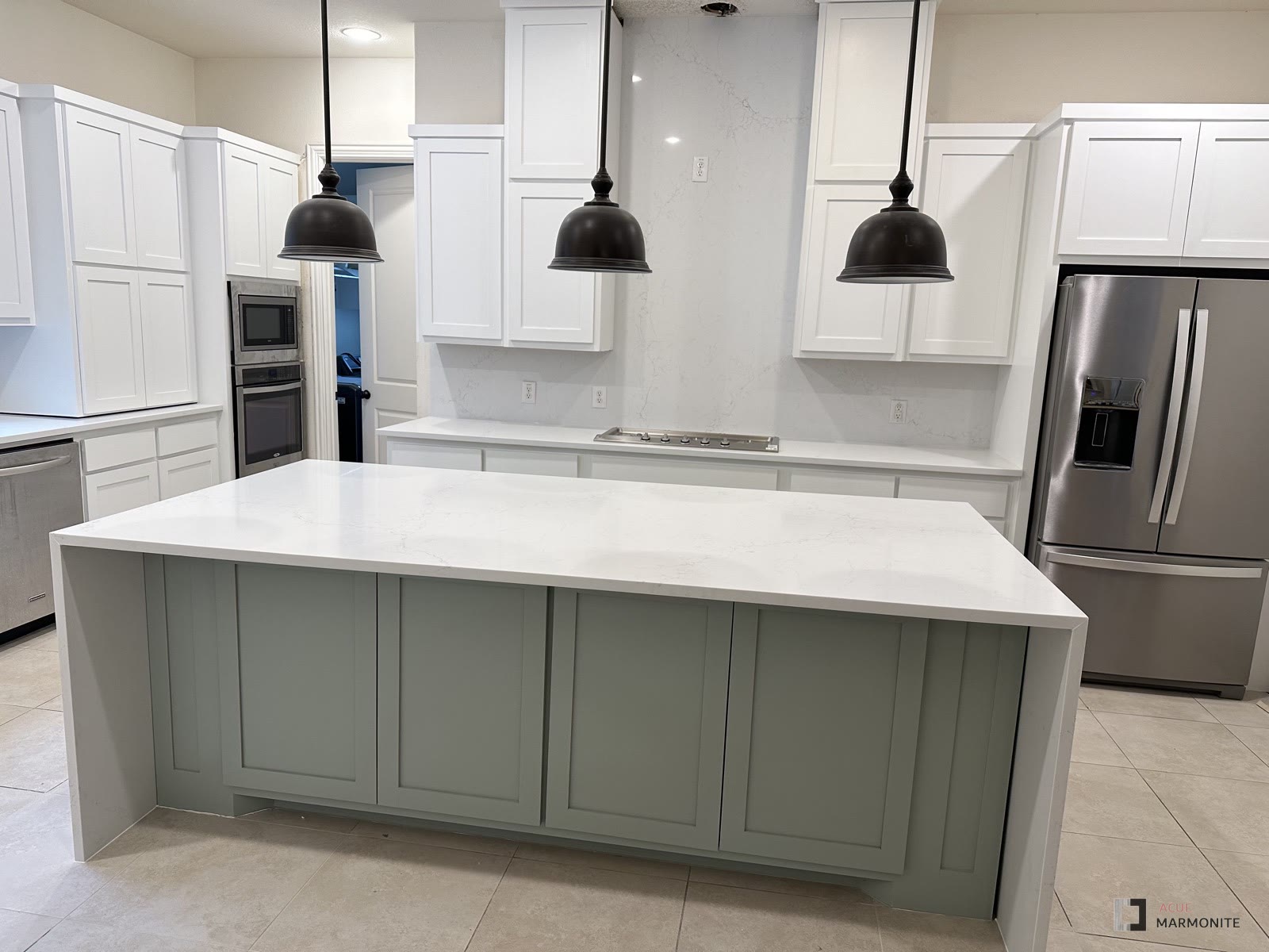Kitchen remodel with waterfall island completed by Acue Marmonite