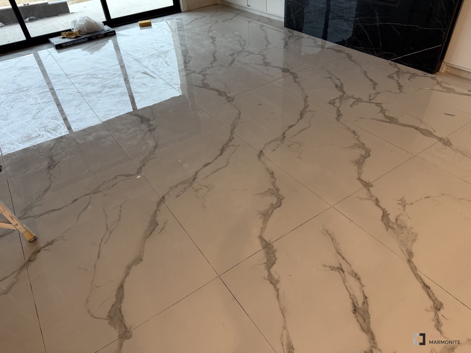 Large-format tile flooring installed by Acue Marmonite